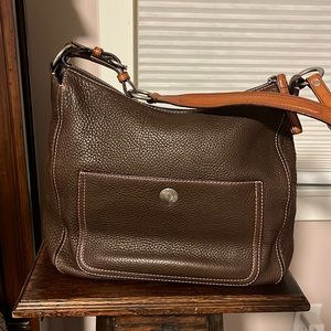 Brown pebbled leather coach bag. Pink stitching. 14.5 inches wide laid flat.